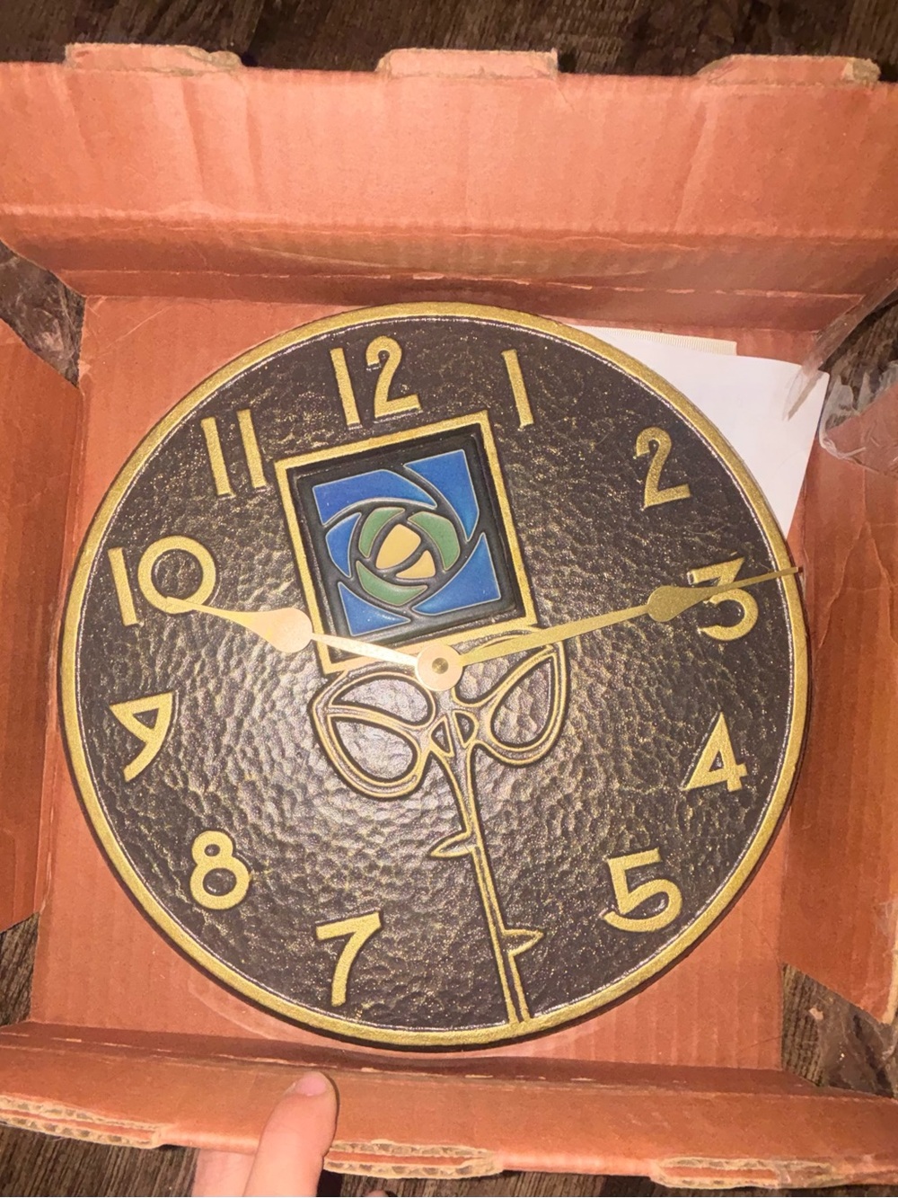 Textured Black Wall Clock with Gold Numerals and Blue-Green Accent